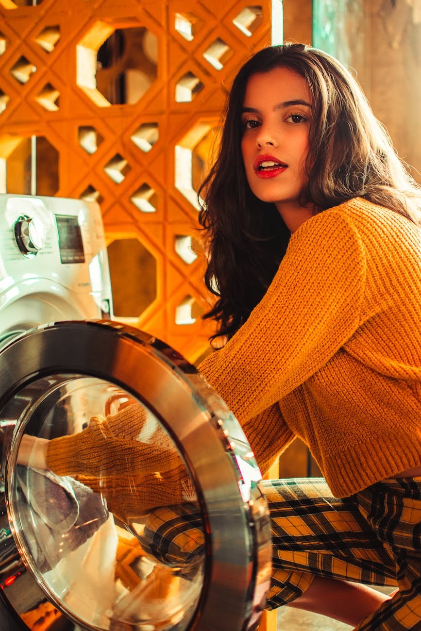 woman wearing orange sweater