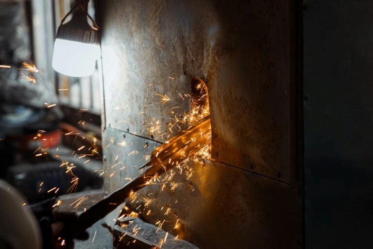 close up of sparks flying from metal grinding process